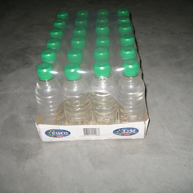 Автоматическая машина линейного типа для упаковки в термоусадочную плёнку  с половинным лотком. Модель КМ-А500